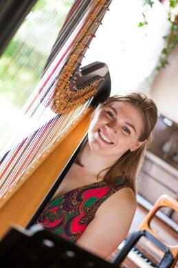 smiling harpist at leicestershire wedding ceremony