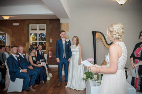 bridesmaid reading at wedding ceremony at catthorpe manor