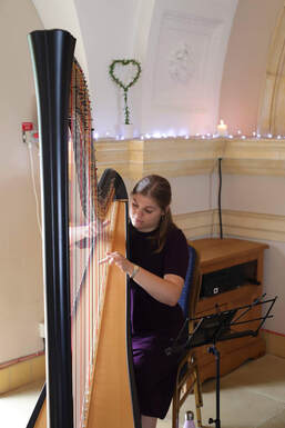 harpist performing at normanton church wedding in rutland